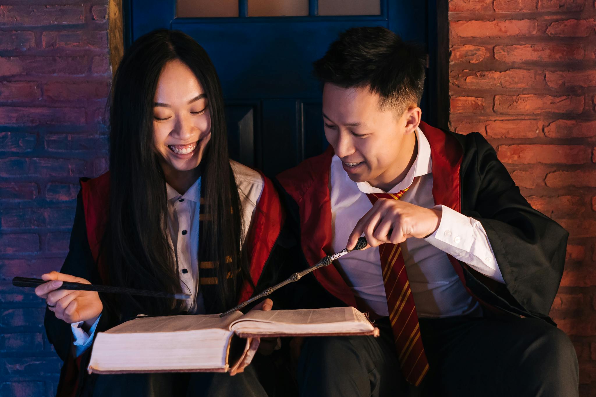 A Man and Woman Having Conversation while Looking at the Book